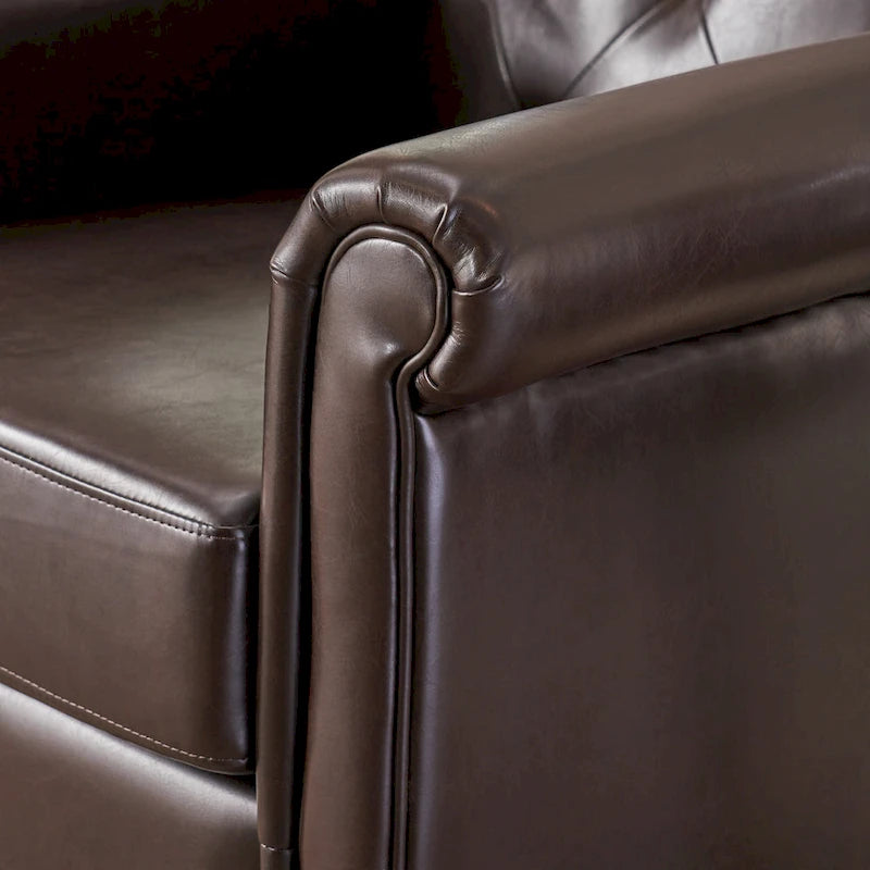 Fauteuil club en cuir marron capitonné