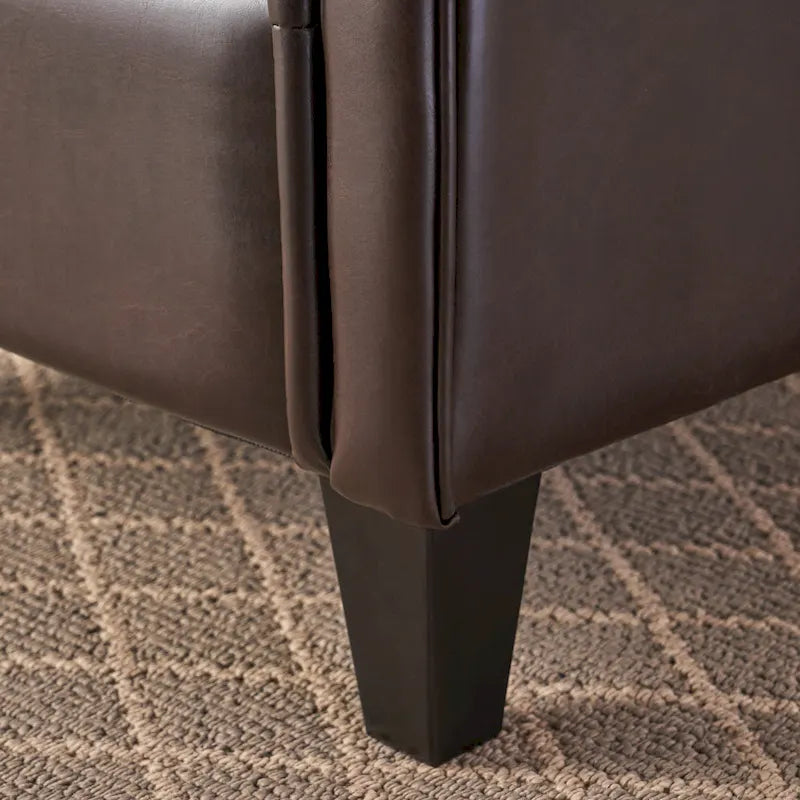 Fauteuil club en cuir marron capitonné