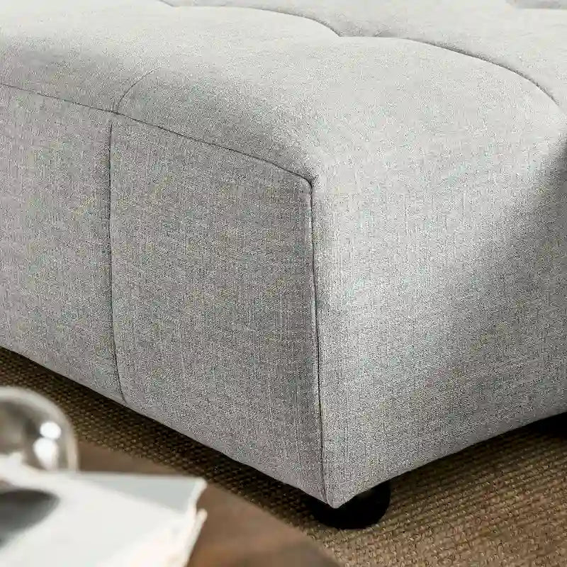Canapé en tissu capitonné avec méridienne