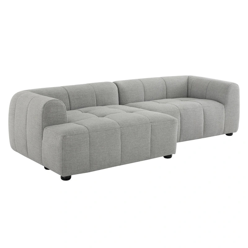 Canapé en tissu capitonné avec méridienne