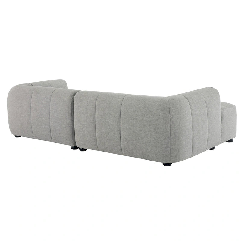 Canapé en tissu capitonné avec méridienne
