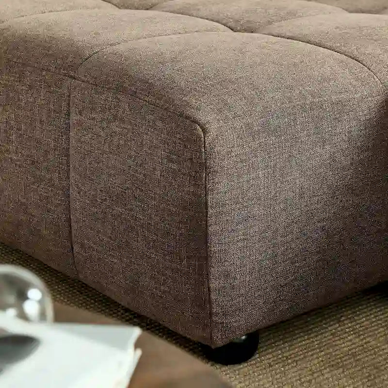 Canapé en tissu capitonné avec méridienne